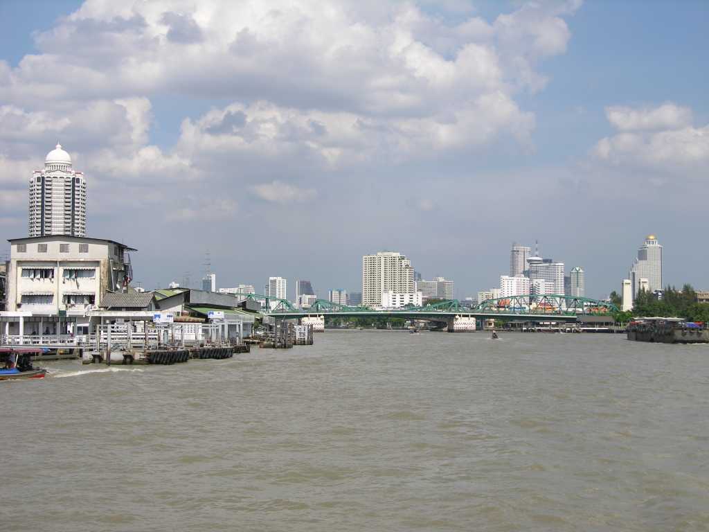 Bangkok 02 11 Bangkok View From Chao Phraya River Here is a view of Bangkok from the Chao Phraya River with the city skyscrapers dotting the river edge.